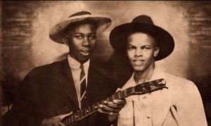 Robert Johnson poses with fellow blues musician Johnny Shines in the newly released photograph.