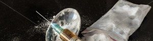 stock-photo-drug-syringe-and-cooked-heroin-on-spoon-140805037